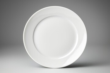 Poster - A simple white plate on a table, suitable for various food and dining concepts