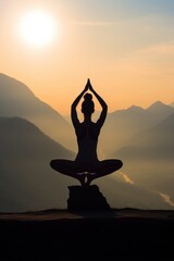 Poster - A person sitting in a yoga pose on a rock. Ideal for health and wellness concepts