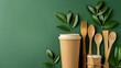 Paper utensils on green background. Paper cups and containers, wooden cutlery. Street food paper packaging, recyclable paperware concept.