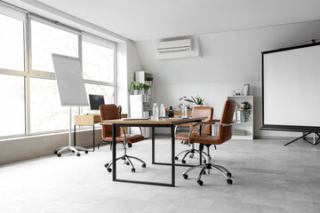 Poster - Interior of light conference hall with screen board, table and armchairs