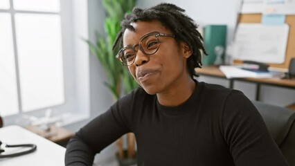 Poster - Crazy fun at the office! young black woman with dreadlocks making a comical fish face while working on her laptop, her squinting eyes full of joy