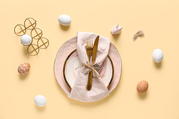 Sticker - Beautiful table setting with Easter eggs and feathers on yellow background