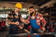 © Zamrznuti tonovi - Workers in protective equipment taking measurements before grinding.