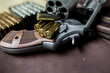.44 magnum revolver conceal classic gun with bullet on leather background