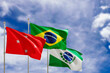 © TexBr - Official flags of the country Brazil, state of Parana and city of Londrina. Swaying in the wind under the blue sky. 3d rendering