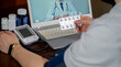 비대면 진료를 하고 있는 환자와 의사(Male patient receiving telemedicine using laptop)