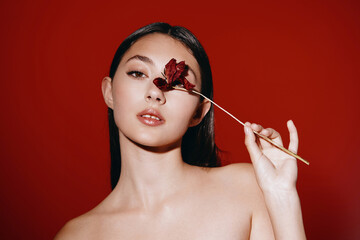 Wall Mural - Glamorous Beauty: Young Caucasian Woman with Attractive Portrait and Pretty Face, Styled in Fashionable Makeup and Elegant Hair, Applying Cosmetics in a Studio Mirror.