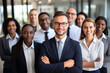 © FutureStock - Portrait of successful group of business people at modern office looking at camera. Multiethnic group of people smiling.