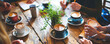 © FATHOM - Close up image of a group cafe meeting