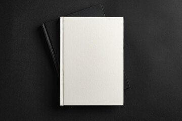 Poster - Hardcover book or notepad mock up on black background