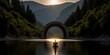 Beneath the majestic arch bridge, a tunnel emerges, its reflection mirrored in the tranquil waters below, creating a mesmerizing visual spectacle