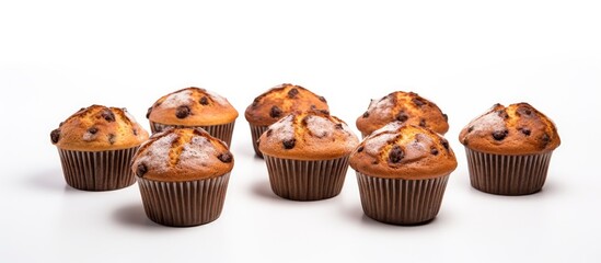 Wall Mural - Delicious Assortment of Freshly Baked Muffins on a Clean White Background