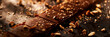 close-up of a bar of dark milk chocolate sprinkled with nut crumbs. Background texture of chocolate