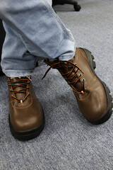 Wall Mural - Photo of a man wearing brown leather shoes and jeans