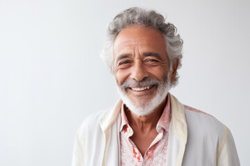 Wall Mural - Confident senior man smiling against white background. Positive aging and lifestyle.