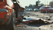 Aftermath of a car crash with scattered debris and a focus on the damaged vehicles.