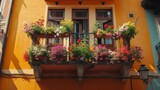 Fototapeta  - Flowers in Flower pot hanging on on traditional Balcony Fence, Spring Beautiful Balcony Flowers on Sunset