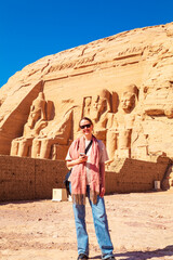 Wall Mural - Woman tourist at Abu Simbel, the great temple of Ramses II.