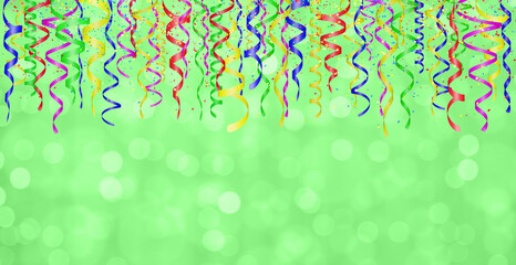 Aufkleber - Falling confetti and curly colorful shiny streamer on green blurred background. Empty space for text