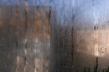 Wall Mural - wet window glass with water droplets. background.