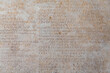 Ancient Roman script on stone, text of Diocletian's edict detailing prices in Latin language, historical artifact from 4th century. Retro text background. Kusadasi, Turkiye (Turkey)