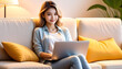 © anmitsu - Beautiful young Asian female freelancer is sitting on a comfortable sofa and browsing the internet on a laptop to successfully conduct business. Luxurious interior. Work from home concept.