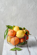 Group of citrus fruits, lemons, oranges, mandarins, clementine, mandarin, on wooden table. Front view.