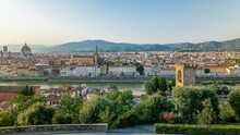 Evening landscape from above timelapse. Panorama on historical buildings aerial view of the Florence from Piazzale Michelangelo point. Italy. Blue sky at summer day.