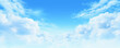 White clouds in a sunny blue sky, peaceful spring ambiance background, heavenly cloudscape