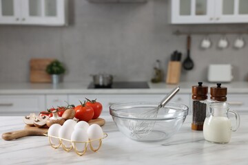 Wall Mural - Whisk, bowl, and different ingredients on white marble table indoors