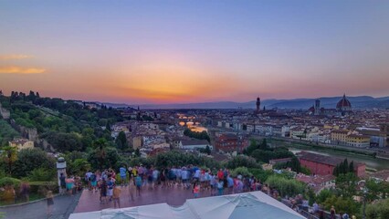 Canvas Print - Skyline panoramic view of Arno River aerial timelapse. Ponte Vecchio from Piazzale Michelangelo at Sunset, Florence, Italy. Crowd on viewpoint. Colorful sky. Evening mist