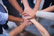 © Jeff B/peopleimages.com - Teamwork, hands and business people with top view of collaboration, partnership or cooperation. Support, unity and partners with finger stack for motivation, team building or success celebration