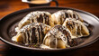 Steamed sweet gnocchi with chocolate filling and vanilla sauce sprinkled with poppy seeds