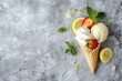 ice cream cone with fruit and leaves on a grey surface