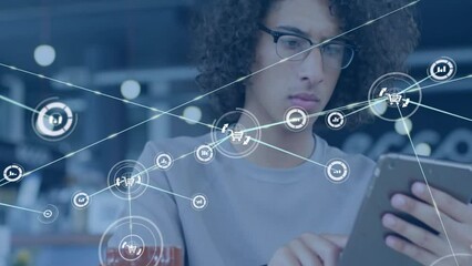 Poster - Animation of network of connections with icons over biracial businessman using tablet in office