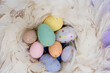Easter scene with colored eggs in nest close up