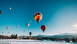 A group of hot air balloons floating over a winter landscape, their vibrant colors contrasting beautifully with the snowy surroundings
