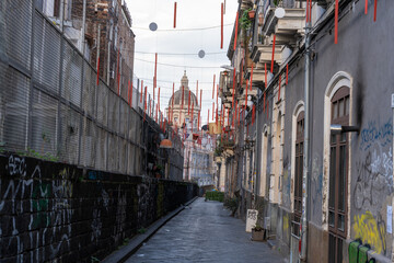 Wall Mural - A narrow alleyway with graffiti on the walls