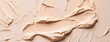 cosmetic smears of creamy texture on a beige background 