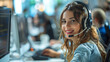 © kitti - Female Customer Service Representative in a Headset Consulting Clients Online. Call center