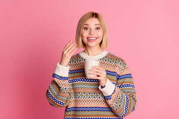 Poster - Portrait of overjoyed optimistic woman with bob hairdo wear ornament pullover smell aromatic cappuccino isolated on pink color background