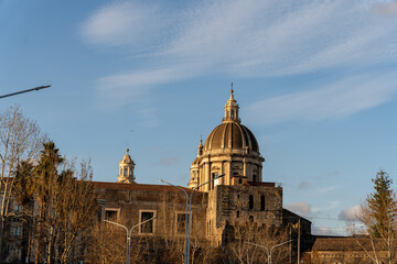 A large building with a dome on top and a clock tower