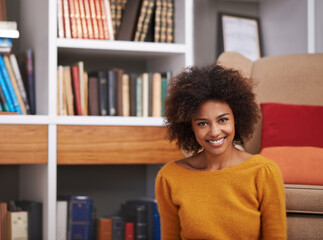 Poster - Portrait, smile and African woman in library, floor and home study for reading or education. Books, novel and story for happy female with natural afro hair, learning and relax for knowledge or hobby