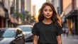 Model Shirt Mockup,young tenager filipina Girl wearing plain black t-shirt on busy city street at sunset from Generative AI