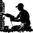 Handyman at a construction site in the process of drilling a wall with a hammer drill