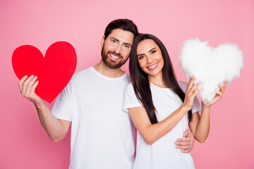 Wall Mural - Photo portrait of lovely young couple hold big red heart fluffy pillow dressed stylish white garment isolated on pink color background