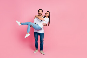 Poster - Full size photo of attractive young couple carry hold girlfriend wear trendy white clothes isolated on pink color background