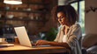 © MP Studio - Close up portrait of young beautiful woman smiling while working with laptop in office.