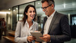 © Studio Nova - Portrait of successful business people holding tablet discuss business issues in the office