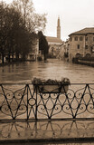 Fototapeta Boho - FURO Bridge and under the swollen RETRONE River during the flood in the city of Vicenza in Italy with vintage toned